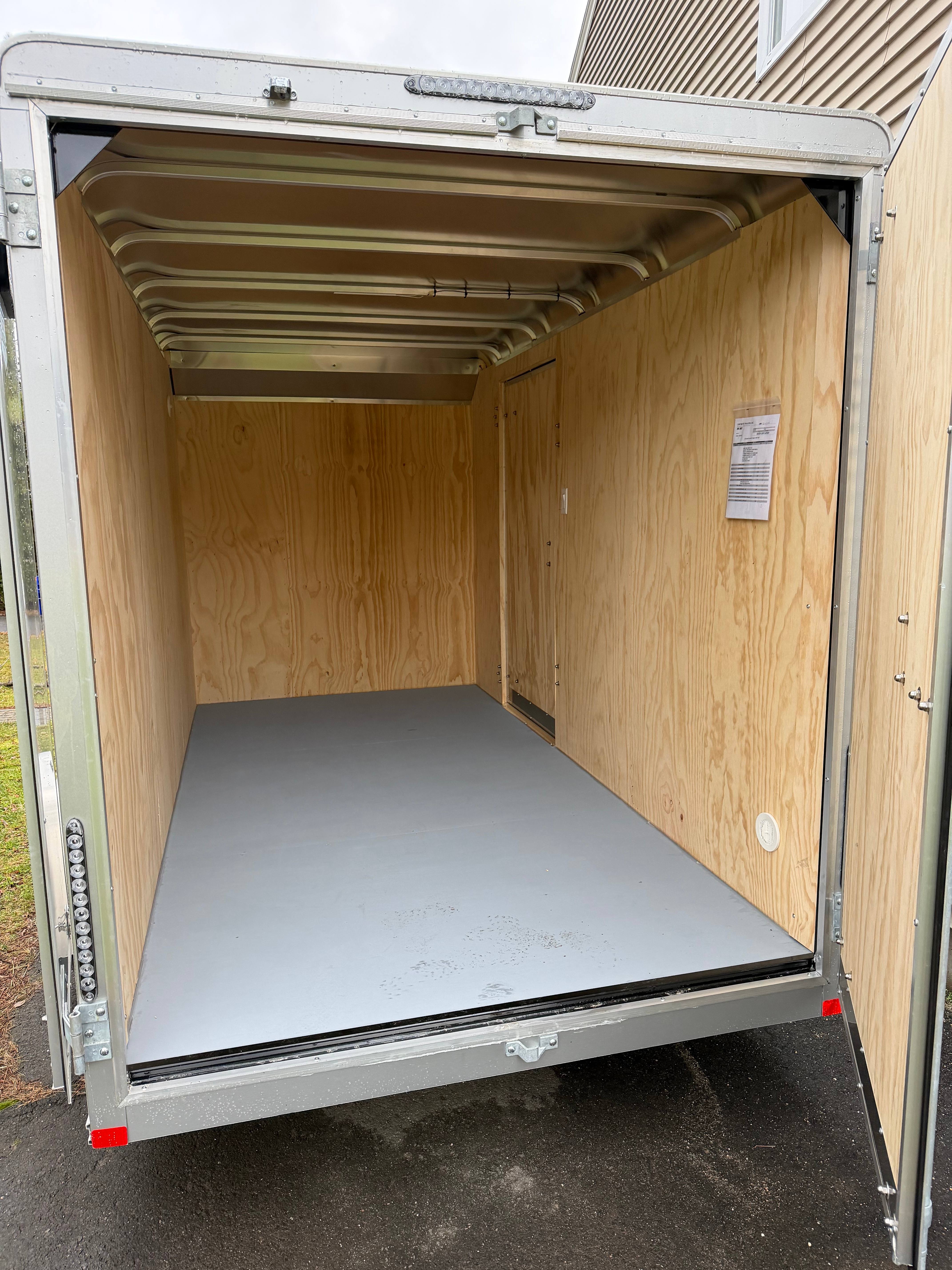 Car Mate enclosed trailer interior with plywood walls
